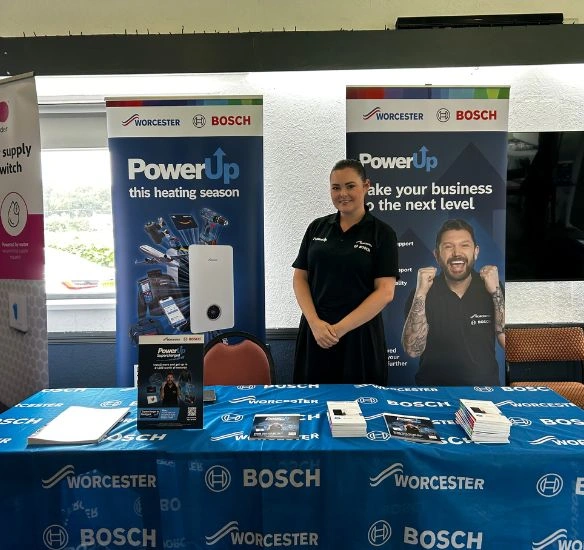 Abbie from finance in front of the finance stand at the Solihull roadshow